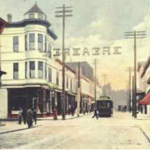Early postcard view of Commercial Street before the 1922 fire. Over-street signage most likely for the Blue Mouse Theatre. Puget Sound Pipeline.