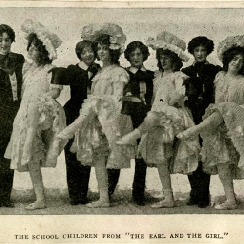 Clipping of a black and white photograph of The School Children from ‘The Earl and the Girl,' standing in a row together.