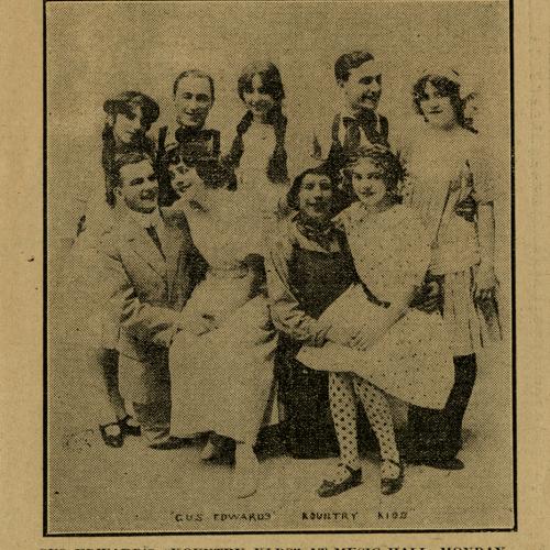 Newspaper clipping of photograph of nine male and female performers “Gus Edward’s ‘Kountry Kids’ at Music Hall, Monday”