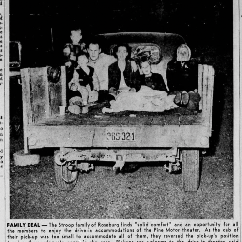 One of first examples of people using the beds of pickup trucks to watch at drive-ins.