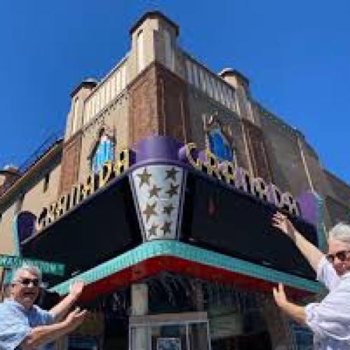 The couple poses in front of their theater (Granada Website) in Oregon!